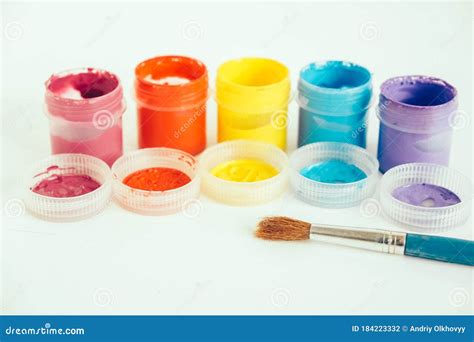 Colorful Gouache Paints And Brush For Painting On White Wooden Table