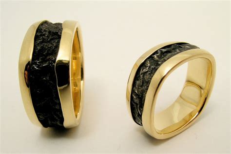 Flowy black and gold wedding bands