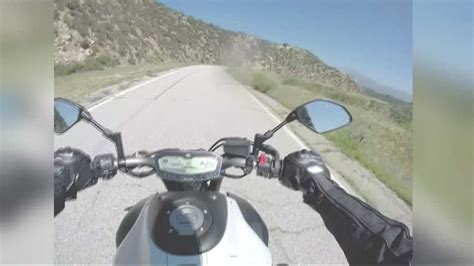 Caught on helmet camera: CA motorcyclist crashes with truck