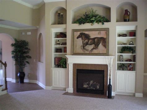 Staging a bookcase in a model home to show buyers how to fill the nooks