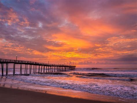 Sunrise Over Fishing Pier At North Carolina Outer Banks Stock Photo