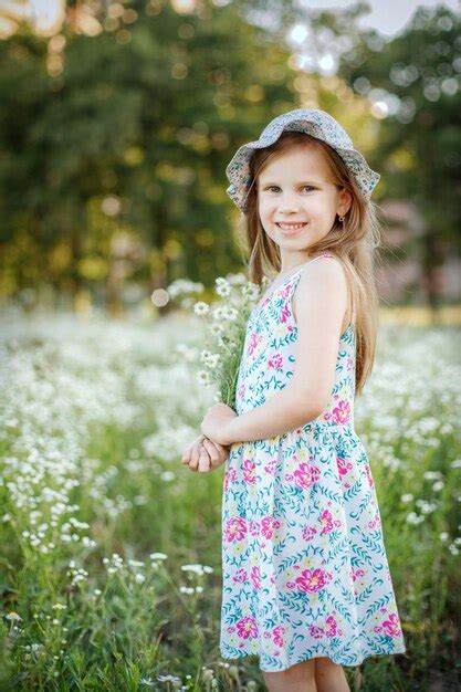 Premium Photo Portrait Of Smiling Girl Standing Outdoors