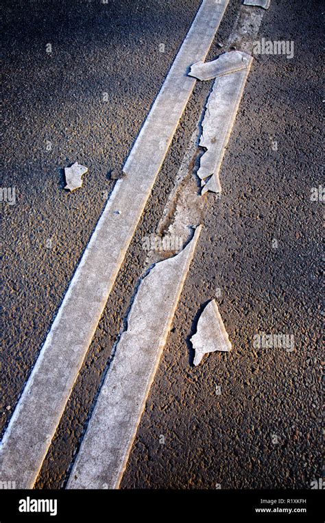 Brocken Line Of An Asphalt Road Marking Close Up Stock Photo Alamy