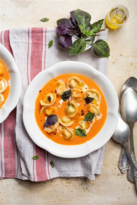 Tomato Soup with Cappelletti Pasta, Cream and Basil Stock Image - Image ...