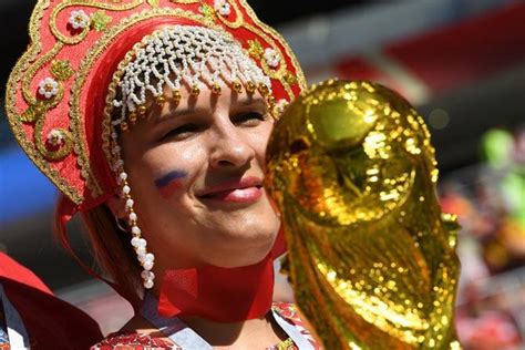 A Russias Fan Poses With A Replica Of The Fifa Russia 2018 World Cup