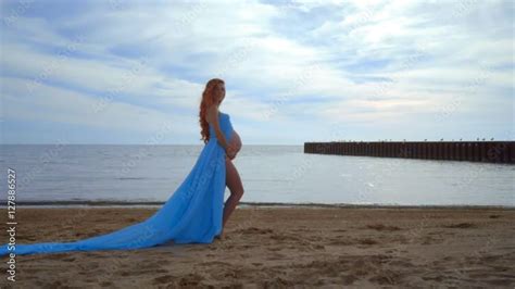 Pregnant Woman With Naked Belly Pregnant Lady In Blue Fabric Flying On Wind Pregnant Model