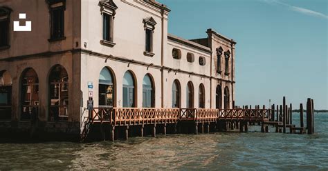 White Concrete Building Beside Body Of Water During Daytime Photo Free Venice Image On Unsplash