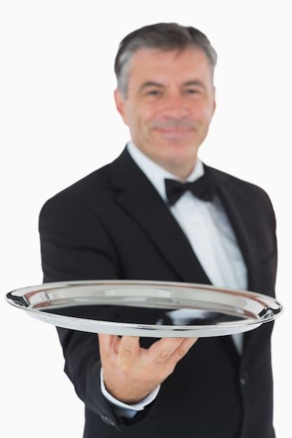 Premium Photo Cheerful Waiter Holding A Silver Tray