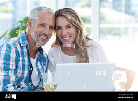 Mature Couple Sitting By Table In Restaurant Stock Photo Alamy