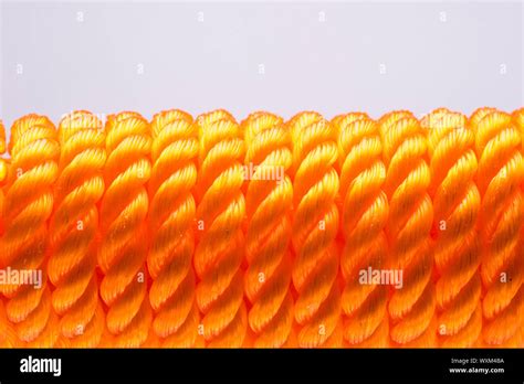 Closeup Of Orange Nylon Rope In White Background Stock Photo Alamy