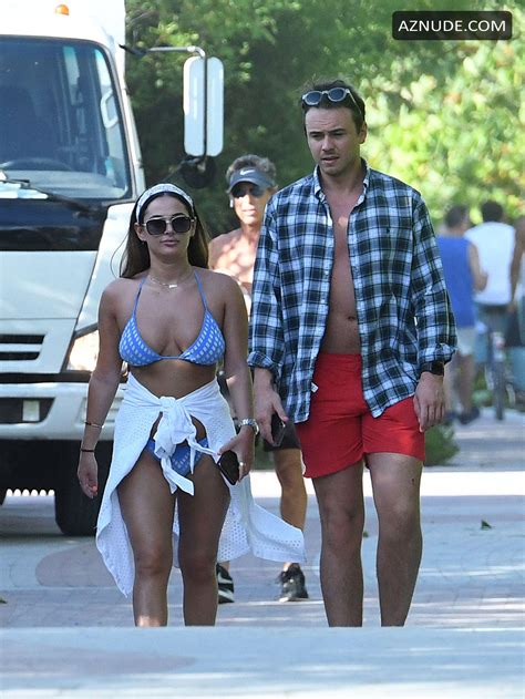 Courtney Green Wears A Blue Bikini As Boyfriend Calum Bushby Takes Photos Of Her On The Beach In