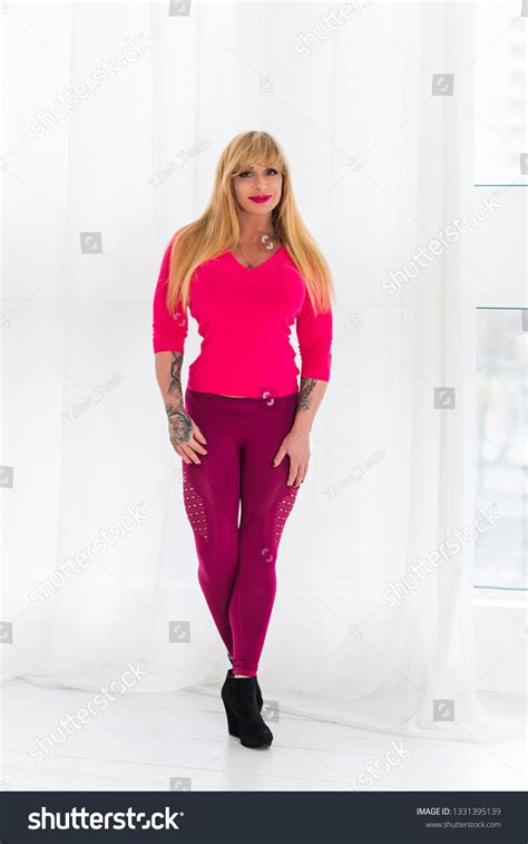 Sexy Mature Fit Athletic Woman Demonstrates Stock Photo