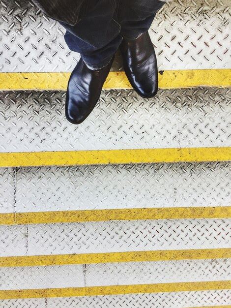 Premium Photo Low Section Of Man Standing On Steps