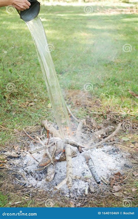 Water Extinguish A Fire From A Bucket Stock Image Image Of Smoldering