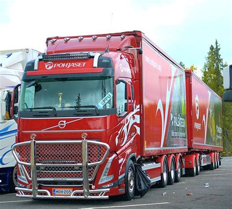 A Red Semi Truck Parked In A Parking Lot