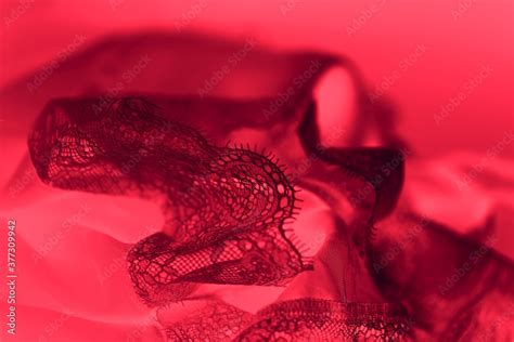 Black Silk Lace Lingerie Flying Fabric On Vibrant Red Color Background Stock Photo Adobe Stock