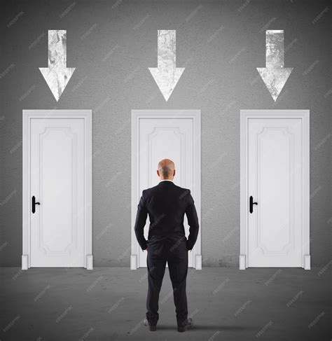 Businessman choosing the right door in which to enter | Premium Photo
