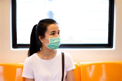 Young Asian Woman Passenger Wearing Medical Hygiene Protective Face