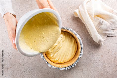 Cooking Cheesecake Woman Hands Pouring A Cream Cheese Into A Crust