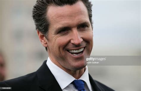 San Francisco mayor Gavin Newsom smiles during a news conference May ...