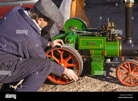 enthusiast cleaning his small steam engine Stock Photo - Alamy