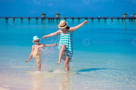 Mother And Daughter Enjoying Time At Tropical Beach 18063375 Stock