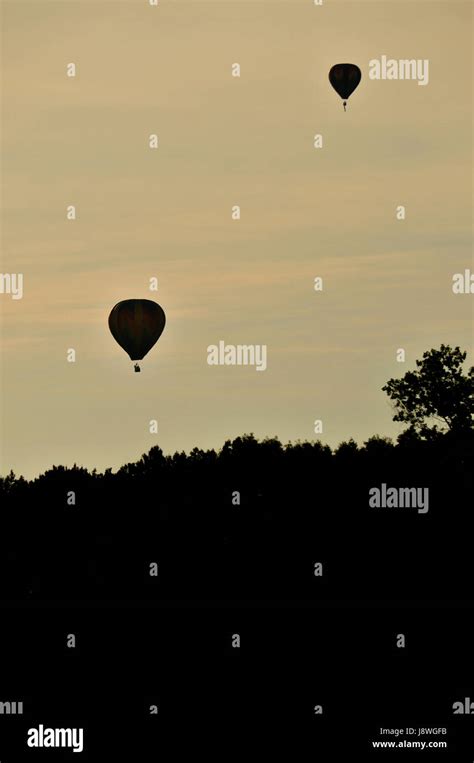 Hot Air Balloon Rising Above The Horizon Stock Photo Alamy