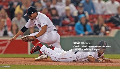 Boston Red Sox third baseman Rafael Devers dives for Toronto Blue ...