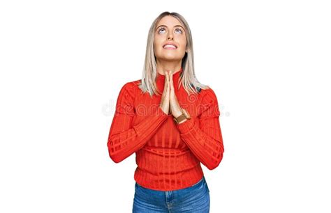 Beautiful Blonde Woman Wearing Casual Clothes Begging And Praying With Hands Together With Hope