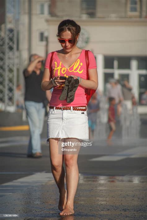 Woman Walks Barefoot In The Hot Weather Of Montreal High Res Stock