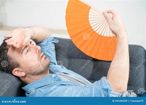 One Man Suffering Summer Heat At Home Trying To Cool Off Stock Image