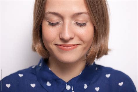 Portrait Of A Beautiful Smiling Woman With Eyes Closed By Stocksy