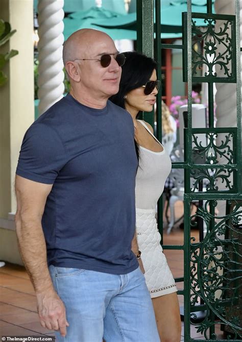 Jeff Bezos And Windswept Lauren Sanchez Look Loved Up As They Check Out