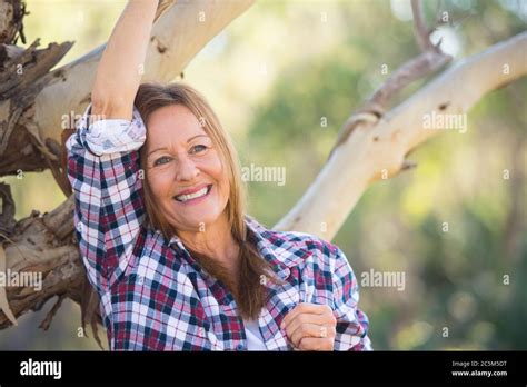 Portrait Attractive Mature Woman In Rural Country Wearing Plaid Shirt