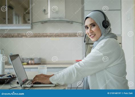 Islamic Muslim Malay Wife Work From Home At The Kitchen Table Stock