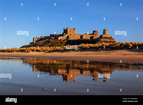 Beautiful Reflection Of Bamburgh Castle Located On The Coast At