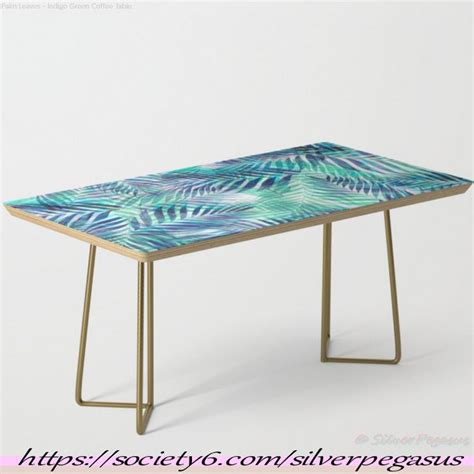 A Blue And Green Table With Gold Legs On White Background In Front Of A