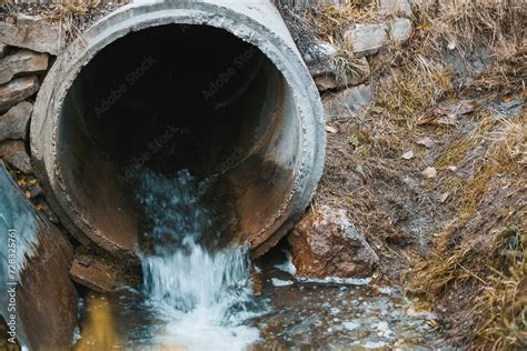 A Sewage Pipe Drains Toxic Wastewater Into A River Causing