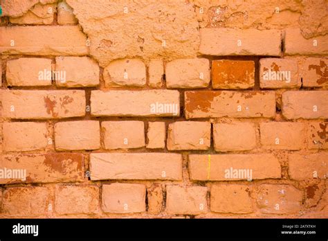 Old damage brick wall with colorful graffiti Stock Photo - Alamy