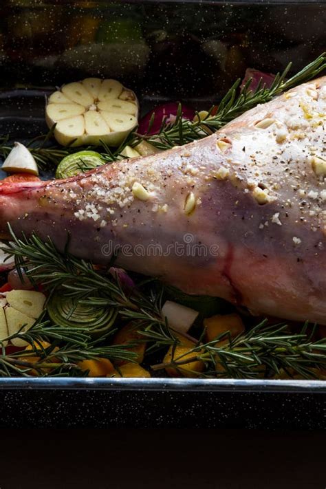 Raw Leg of Lamb in Roasting Tray Dressed with Vegetables Stock Image ...