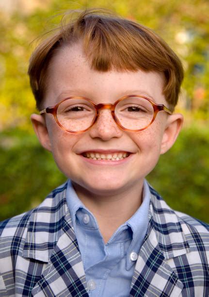 boy redhead freckles happy  glasses child smiling wearing