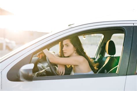 Woman In Car On Parking Lot By Stocksy Contributor Javier D Ez