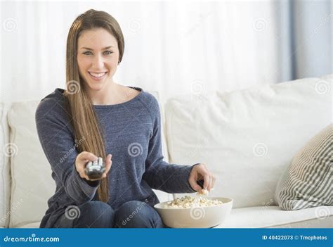 Woman Eating Popcorn While Watching Tv Stock Image Image Of People