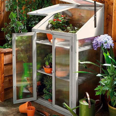 Grow your own with affordable Aldi greenhouse and potting bench