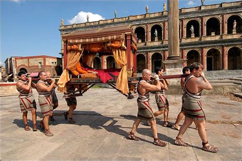 Patrician In His Litter Carried By Slaves In The Roman Forum In Front