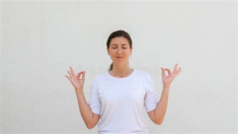 Portrait Of Happy Young Woman Meditating With Closed Eyes Stock Image