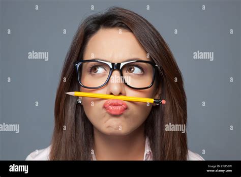 Female Executive Balancing Pencil On Lip Stock Photo Alamy