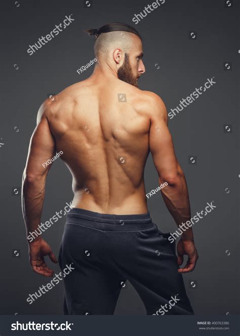 Muscular Man S Back On A Grey Background Stock Photo 400763386