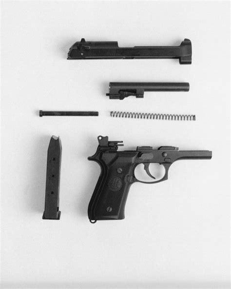 A Close Up View Of A Disassembled M 9 9mm Beretta Pistol On Display At