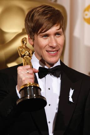 Dustin Lance Black holds his Oscar for best original screenplay, for ...